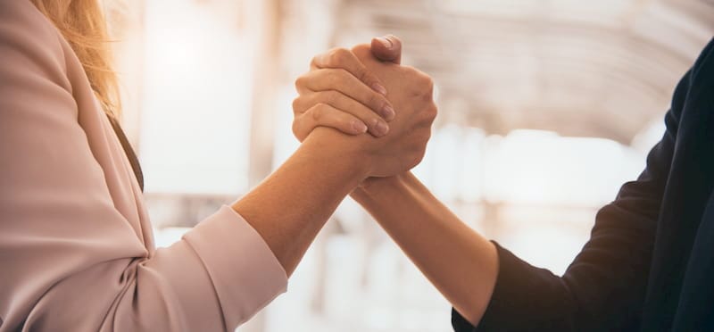 Business partners shaking hands