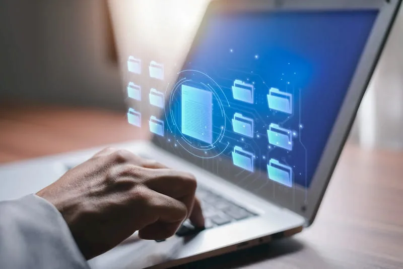 Man looking at documents on his Laptop